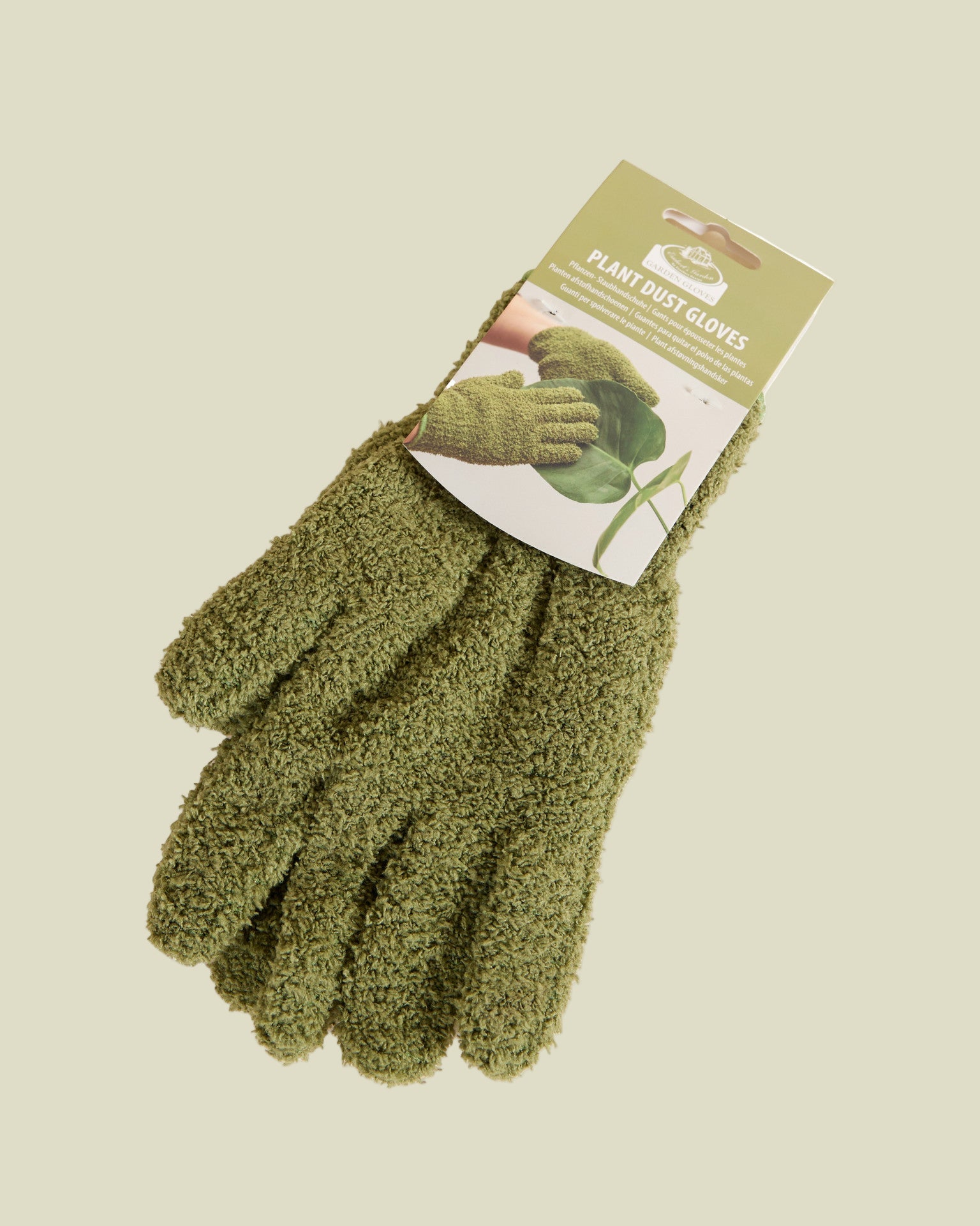 microfiber green leaf care gloves on a beige background