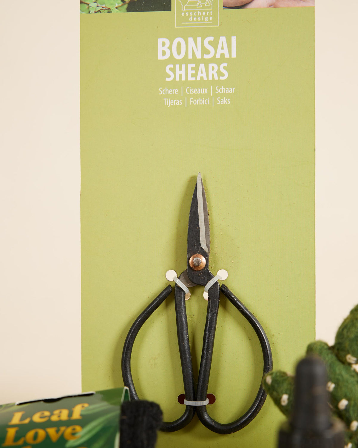 Bonsai shears on a green packaging with 'Leaf Love' branding.